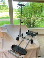 Overall view of Leg Magic glider trainer folded on cloth
