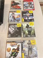 PS3 game cases laid out showing titles and condition