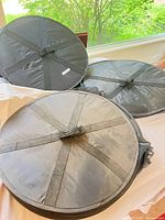 three racks folded into round disks