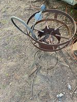 Full view of tripod burner, hose and regulator visible