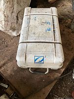 Top view of white Zodiac hard plastic life raft case