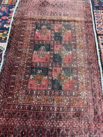 Full view of Baluchi rug showing overall design and size