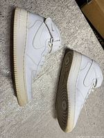 Full side view of both sneakers showing uppers and soles
