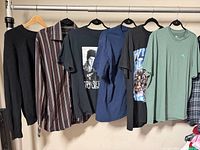 all six tops hanging on rack