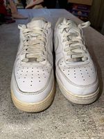 Top view of both sneakers highlighting toe box perforations and lace dubraes