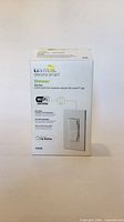Front of sealed Leviton Decora Smart Dimmer box showing model and Wi-Fi compatibility