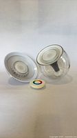 Two Philips LivingColors lights and remote displayed