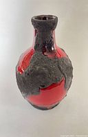 Front view of red Roth Keramik Fat Lava vase showing lava texture
