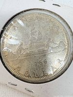 Reverse of 1966 Canada silver dollar showing canoe Voyageur design
