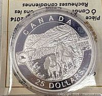 Obverse side of coin in capsule showing cowboy design and $25 denomination