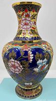 Full frontal view of blue and gold cloisonné vase showing overall shape and decor