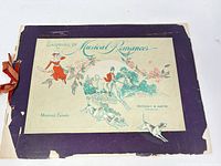 Front cover showing title, illustration, wear, ribbon