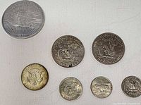 Group shot of all seven coins