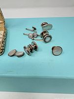 Overview of cufflinks, shirt studs and presentation box