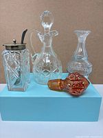 Group shot of all glass items on blue box