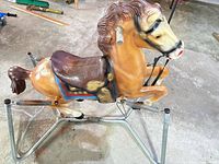 Full view of rocking horse on spring frame