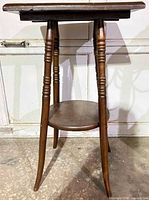 Front view of vintage two-tier end table