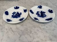 Two flow blue porcelain plates top view