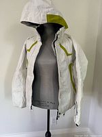 Front view of Rossignol white ski jacket on mannequin