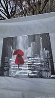 Front view of entire painting showing cityscape, red umbrella, signature