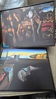 Both Dalí prints displayed side by side in their frames