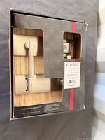 Retail box showing Baldwin Prestige Spyglass lever set through window