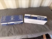 Two retail boxes labeled FH-8400B Commercial Door Closer
