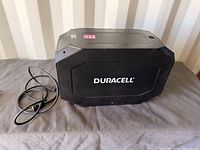 Front view of Duracell PowerSource 660 with attached charge cord