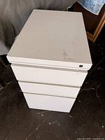 Top view of white metal 3-drawer file cabinet