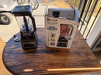 Blender assembled beside original box on table