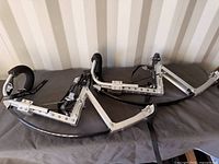 Full view of both stilts laid side by side