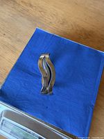 Two wavy sterling silver bangles upright showing wavy profile