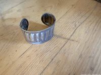Front view of sterling cuff showing ribbed exterior