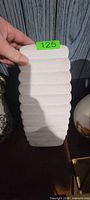 Front view of rectangular white ribbed ceramic vase
