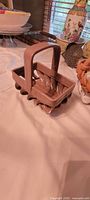 Taupe rectangular ceramic basket front and handle detail