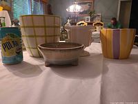 Group shot of all four ceramic planters on table