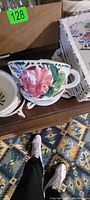 Oversized floral cup with matching saucer below