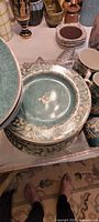 Stack of patterned plates showing design detail