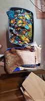 Tote with assorted floral, green, blue fabrics and bag with leopard and white fabrics