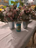 Both floral arrangements with scale reference
