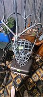 Close angle highlighting lattice shelf construction and hanging tassel detail