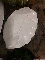 Leaf-shaped white glass platter overall view