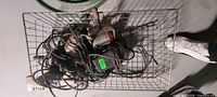 Top view of wire basket showing all corded power tools and cords