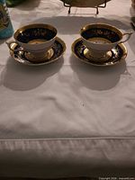 Two Paragon cups each on its saucer