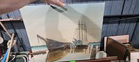 Full view of painting showing boats, pier, and shoreline