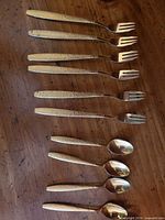 Top view showing all six forks and four spoons aligned