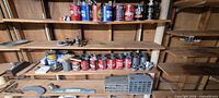 Wide view of shelving with coffee tins and organizer