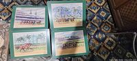 Four matted horse racing prints laid out