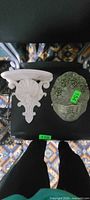 Both wall décor items side by side