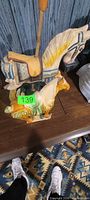 Two horse figurines on table
